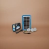 Blue-framed solar panel, black portable lamp with three LED bulbs and charging cable details Picture